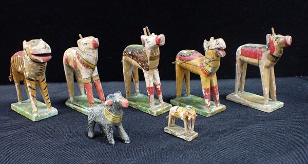 SEVEN INDIAN CARVED AND PAINTED WOODEN TOY ANIMALS