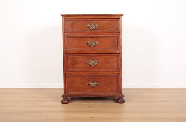 A LATE VICTORIAN WALNUT CHEST OF DRAWERS