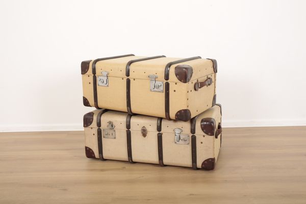 TWO STEAMER TRUNKS WITH WOODEN BRACES AND REINFORCED LEATHER CORNERS