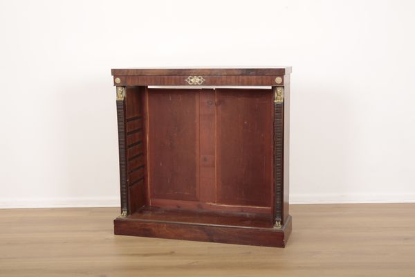 AN EMPIRE MAHOGANY AND GILT METAL MOUNTED OPEN BOOKCASE