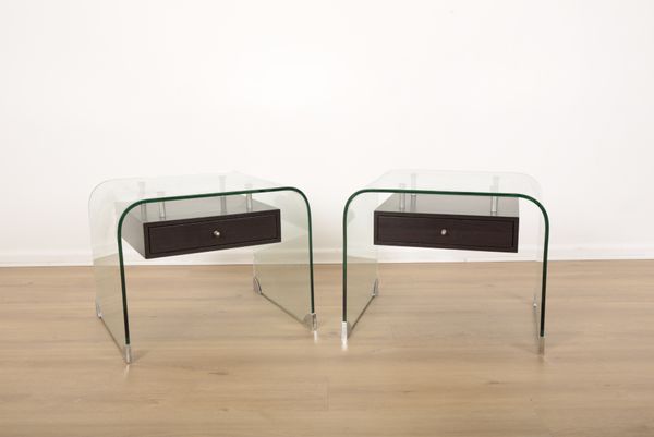 A PAIR OF CONTEMPORARY LOW CURVED GLASS TABLES