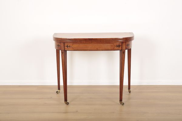 A REGENCY SATINWOOD AND MAHOGANY DEMI-LUNE CARD TABLE