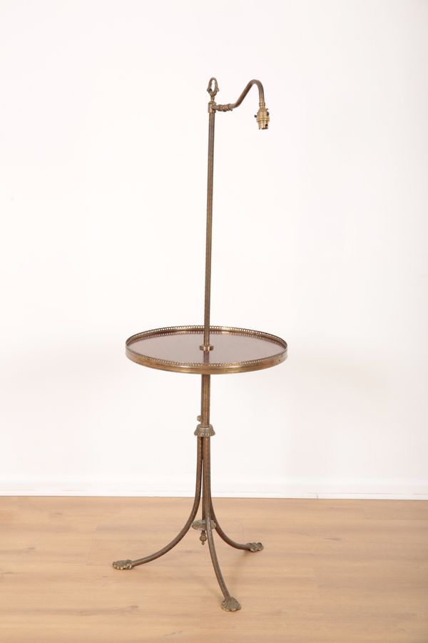 AN EDWARDIAN MAHOGANY AND BRASS STANDARD LAMP TABLE