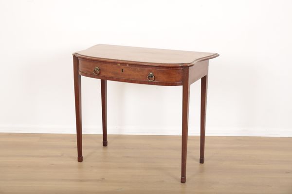 A GEORGE III SERPENTINE MAHOGANY AND SATINWOOD OCCASIONAL TABLE