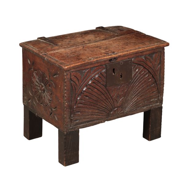 A CARVED OAK COFFER OF SMALL PROPORTIONS