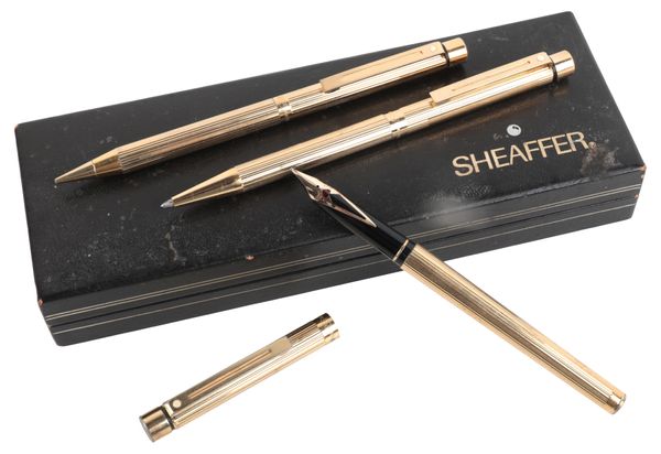 A SHEAFFER GOLD PLATED THREE PIECE SET