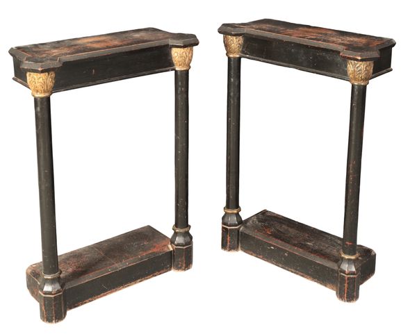 A PAIR OF EBONISED AND PARCEL GILT CONSOLE TABLES