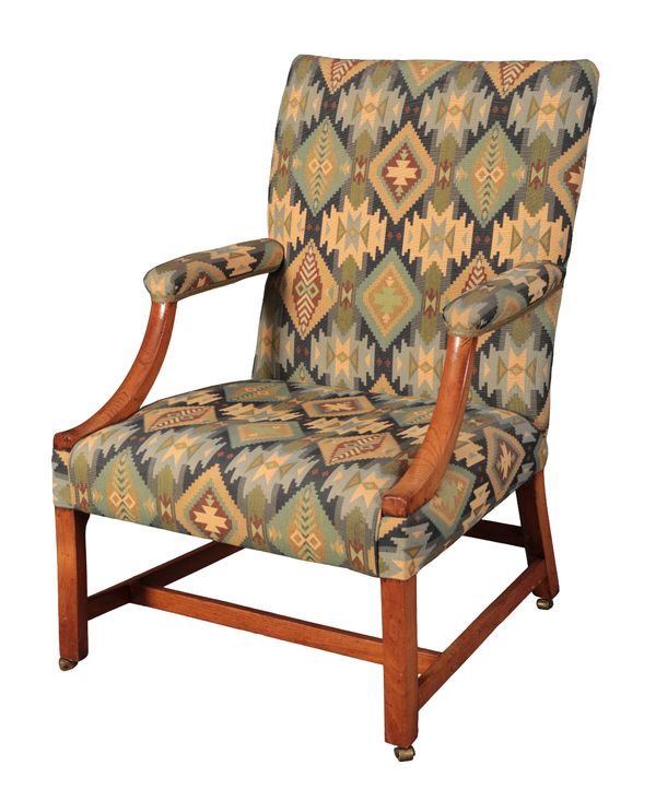 A GEORGE III WALNUT GAINSBOROUGH ARMCHAIR