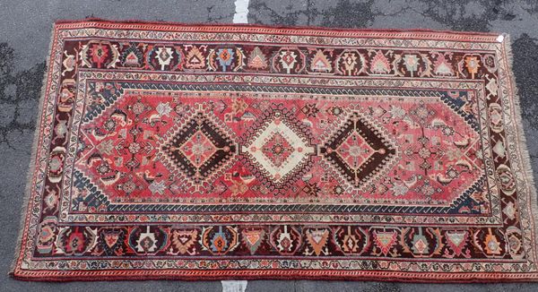 A RED GROUND SHIRAZ RUG