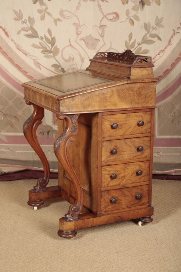 A VICTORIAN WALNUT DAVENPORT