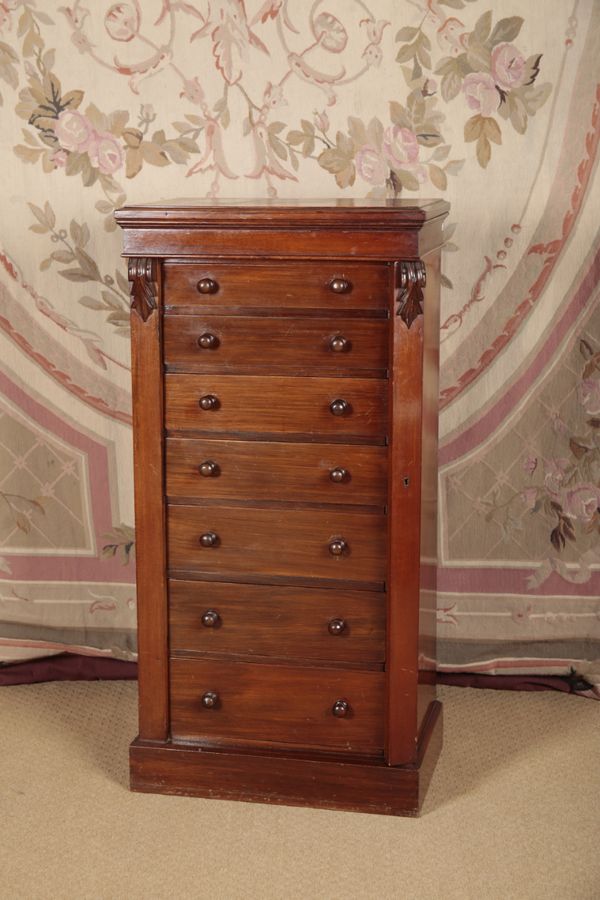 A VICTORIAN WALNUT WELLINGTON CHEST