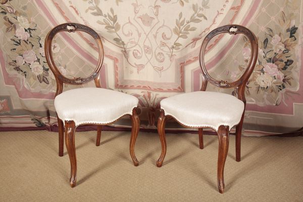 A PAIR OF VICTORIAN WALNUT BALLOON-BACK SIDE CHAIRS