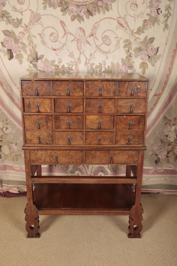 AN UNUSUAL WALNUT AND BURR WALNUT COLLECTORS CHEST ON STAND