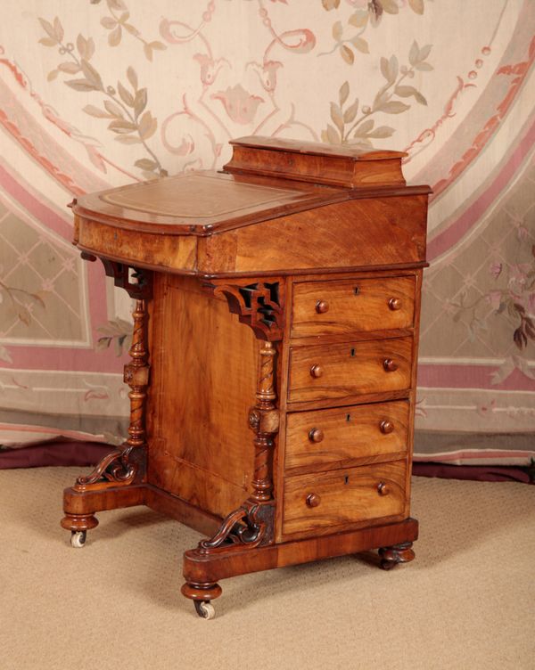 A VICTORIAN WALNUT DAVENPORT