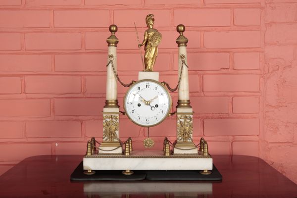 A WHITE MARBLE AND ORMOLU MOUNTED PORTICO CLOCK