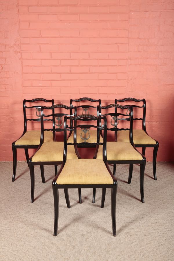 A SET OF SIX REGENCY EBONISED DINING CHAIRS