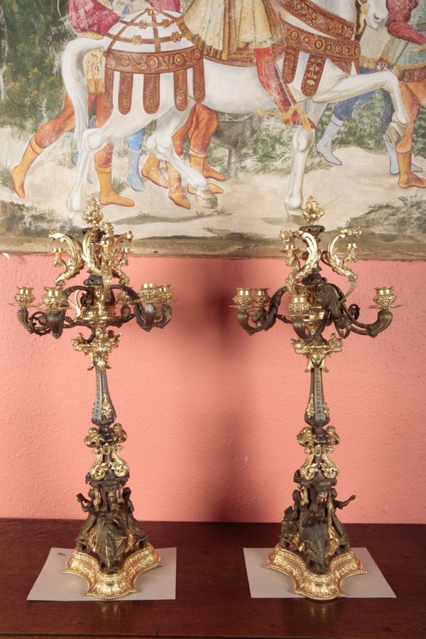 AN IMPRESSIVE PAIR OF FRENCH BRONZE AND GILT METAL CANDELABRA