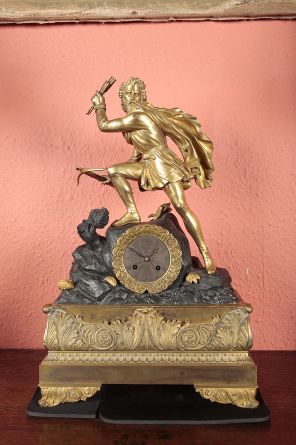 A FRENCH GILT METAL MANTEL CLOCK BY ELIE A PARIS