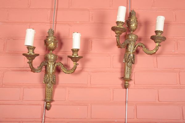 A PAIR OF GILT METAL TWO BRANCH WALL LIGHTS