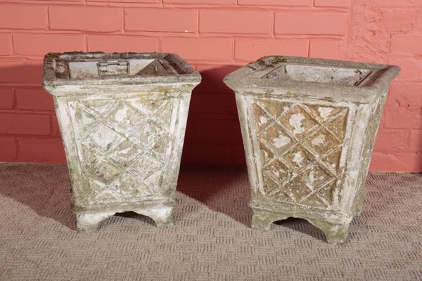 A PAIR OF COMPOSITE STONE PLANTERS