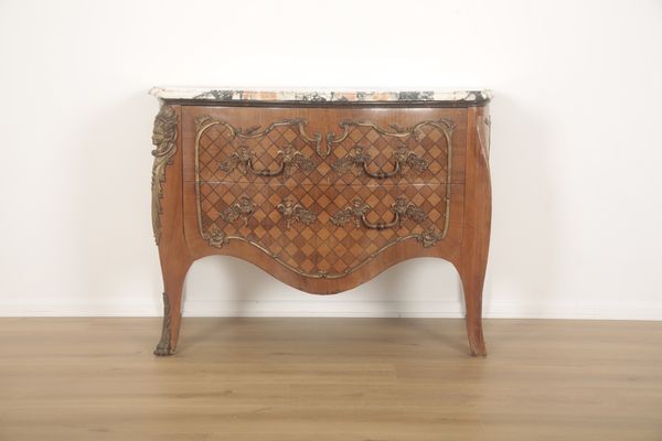 A FRENCH BOMBE COMMODE IN LOUIS XV STYLE