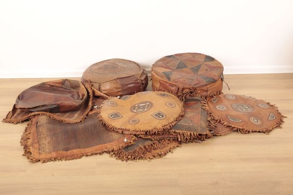 A COLLECTION OF AFRICAN LEATHER CUSHIONS