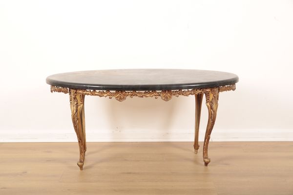 AN OVAL FAUX MARBLE TOP COFFEE TABLE