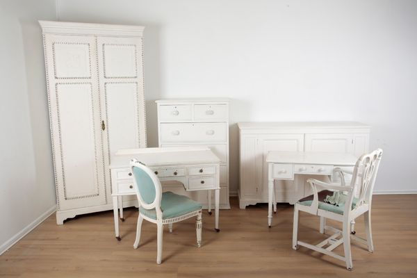 A WHITE PAINTED PINE SET OF MATCHED BEDROOM FURNITURE