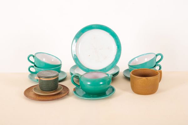 A STUDIO POTTERY TEACUP AND SAUCER