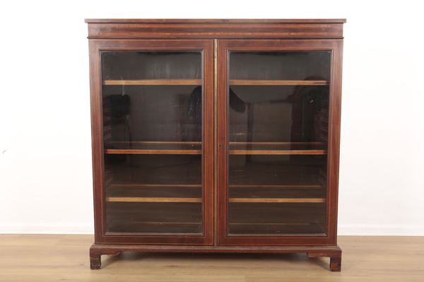 AN EDWARDIAN INLAID MAHOGANY BOOKCASE