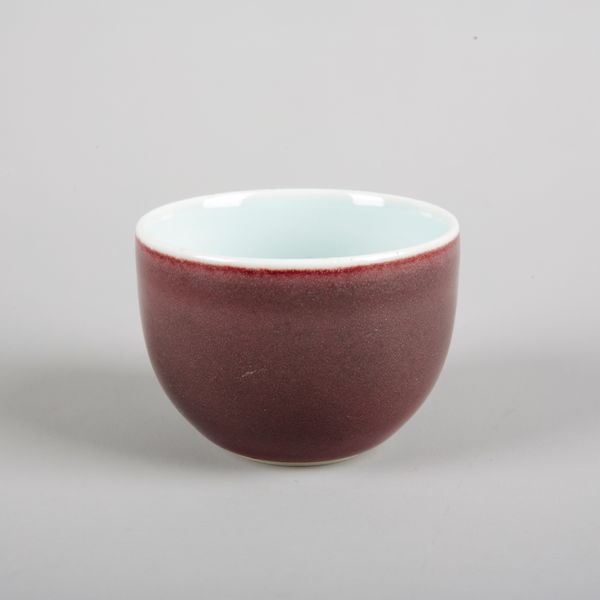 A CHINESE PORCELAIN SANG DE BOEF CUP
