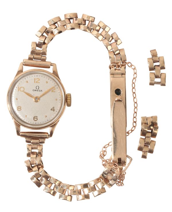 OMEGA: A LADY'S VINTAGE 9CT GOLD DRESS WATCH