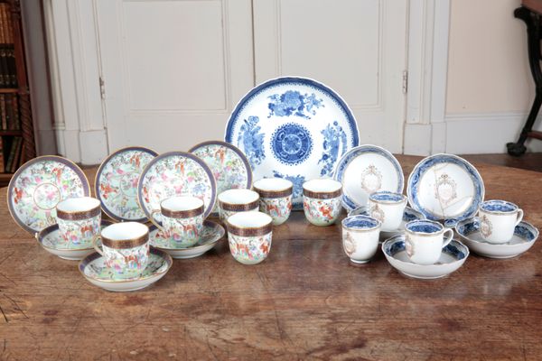 A SET OF FOUR CHINESE EXPORT ARMORIAL COFFEE CANS AND SAUCERS