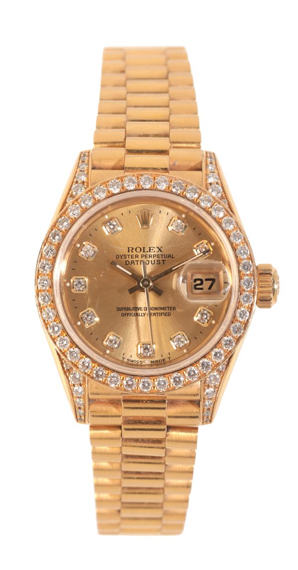 ROLEX OYSTER PERPETUAL DATEJUST: A LADY'S 18CT GOLD AND DIAMOND BRACELET WATCH