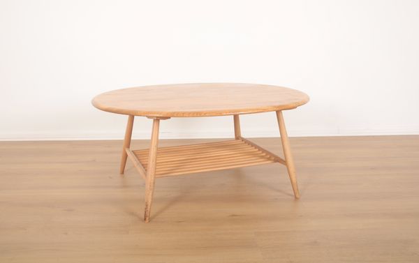 AN ERCOL BLONDE ELM COFFEE TABLE