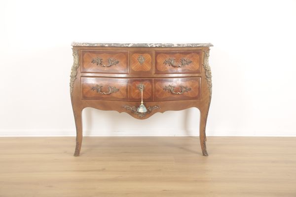 AN ORMOLU MOUNTED KINGWOOD COMMODE OF LOUIS XV DESIGN