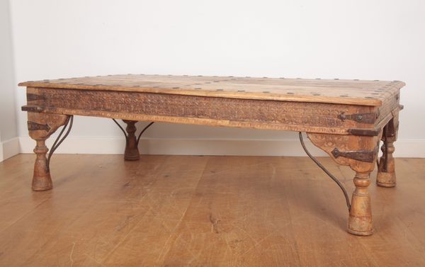 AN INDIAN CARVED WOOD COFFEE TABLE