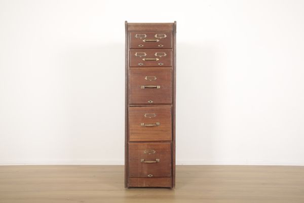 AN OAK FILING CABINET WITH SIDE PANELS