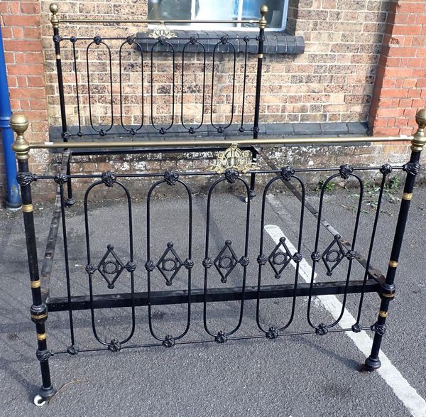 A VICTORIAN JAPANNED IRON AND BRASS BEDSTEAD