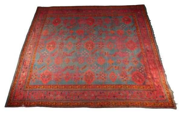 AN ANTIQUE USHAK CARPET