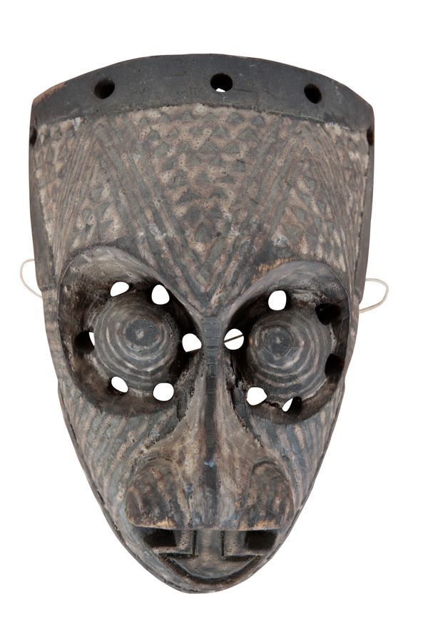 FOUR CARVED WOOD AFRICAN MASKS