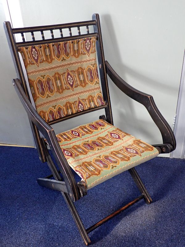 A VICTORIAN 'AESTHETIC' EBONISED FOLDING CHAIR