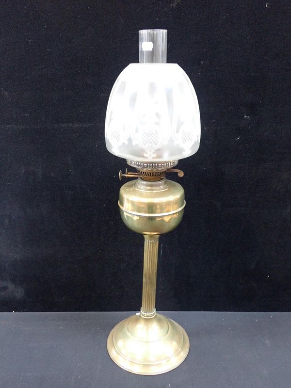 A BRASS TABLE OIL LAMP AND SHADE