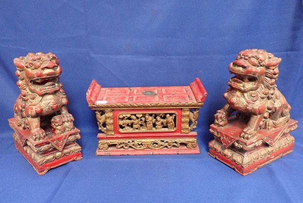 A PAIR OF PAINTED AND GILTWOOD CHINESE TEMPLE LIONS