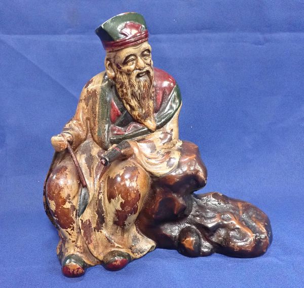 A JAPANESE BRONZED AND PAINTED FIGURE