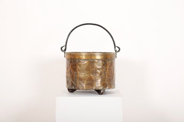 A BRASS AND IRON RIVETED LOG BIN