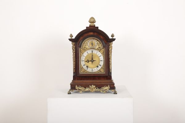 A WALNUT CASED BRACKET CLOCK