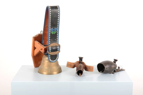 A GIANT BRASS ALPINE COW BELL