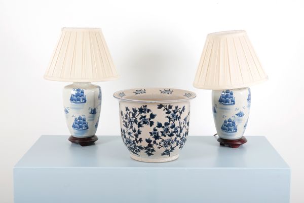 A PAIR OF BLUE AND WHITE PORCELAIN LAMPS DECORATED WITH SHIPS
