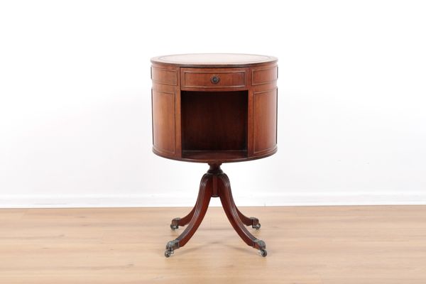 A REGENCY STYLE MAHOGANY DRUM REVOLVING BOOK TABLE